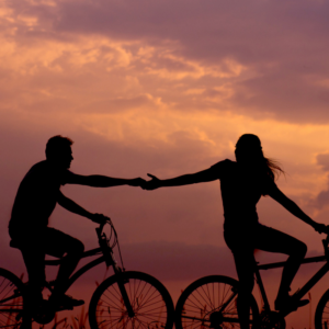 Couple Silhouetting against Sunrise or Sunset